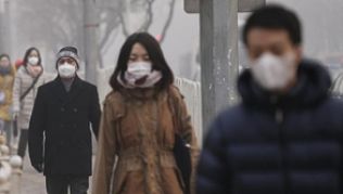 Smog in Peking: Die Luftverschmutzung gilt als einer der Gründe für den Einbruch im Tourismus##Foto: Rolex Dela Pena Smog in Peking: Die Luftverschmutzung gilt als einer der Gründe für den Einbruch im Tourismus
